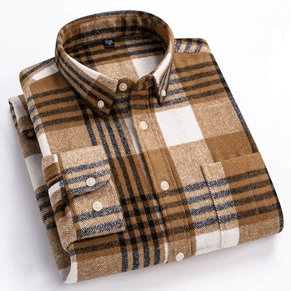 Folded plaid shirt with brown, beige, and black pattern on a white background