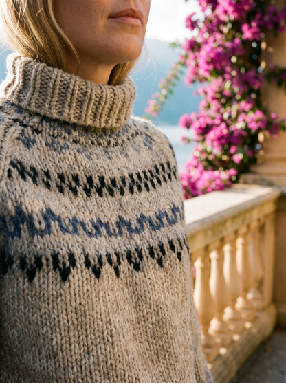 Close-up of the Fair Isle yoke pattern and chunky knit of a grey roll-neck jumper — Aveloire